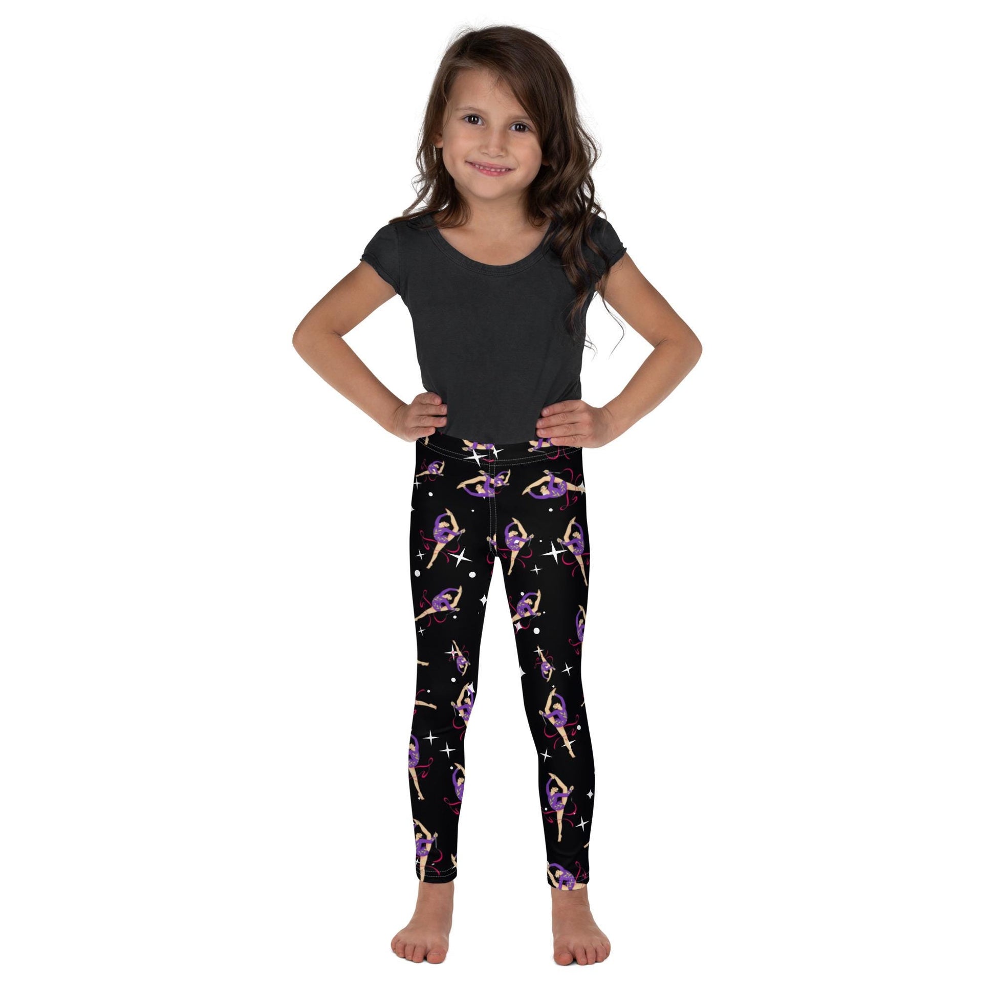 Leggings petite fille portés – vue de face, tissu doux et extensible - noir étoilé  - motif gymnaste danseuse 